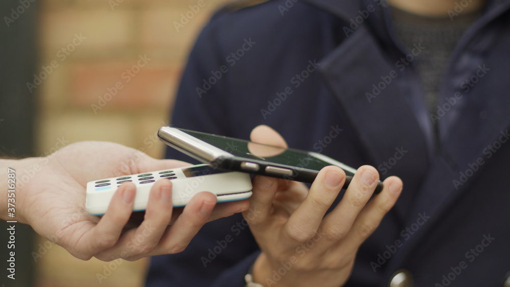 Contactless payment with a smart phone outside venue Contactless payment with a smart phone outside venue