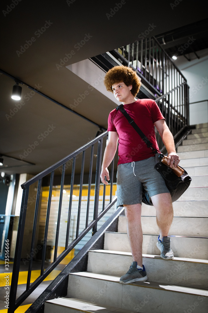 Tired fat man thinking over weight problems, desire to lose weight, gym workout Tired fat man thinking over weight problems, desire to lose weight, gym workout