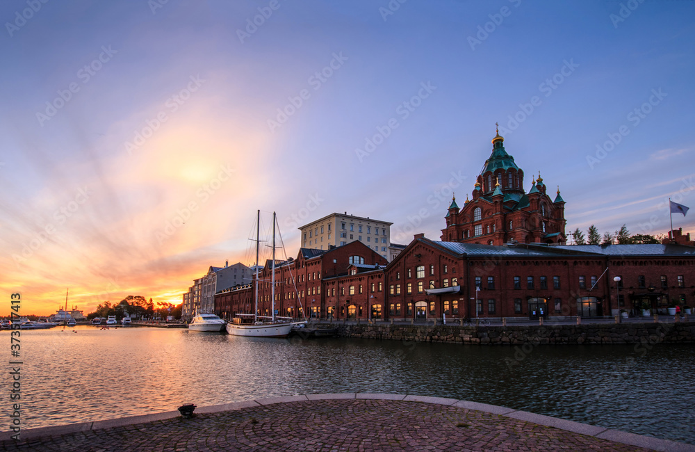 Amazing sunrise cityscape in North Harbour, Pohjoissatama, Helsinki downtown, Finland, Uspenskin kathedral