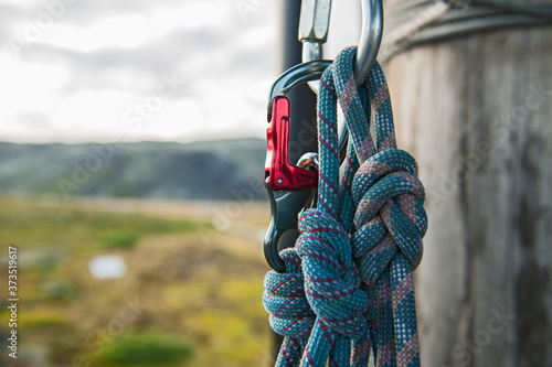 close up of carabiner and rope at high rope obstacle course photo