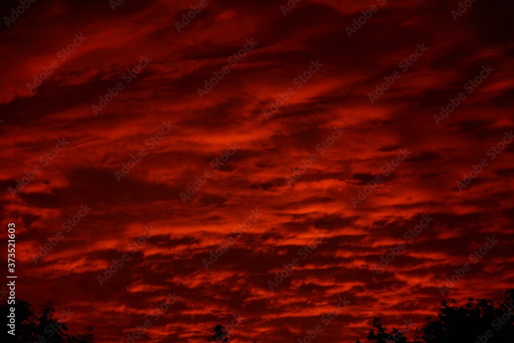 Dark red skies at sunset.