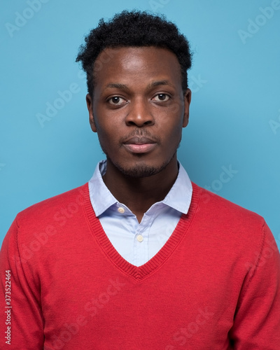 Fotografie Portrait of real black african man with no expression for ID or passport photo