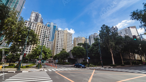 Bonifacio Global City, Taguig, Metro Manila - Aug 2020: Exclusive residential condominiums in Fort Bonifacio. An intersection and pedestrian crossing in the front.