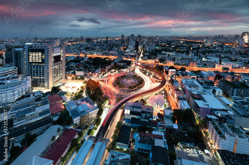 Photography Cityscape of Victory Monument with car traffic on roundabout road at Bangkok, Th