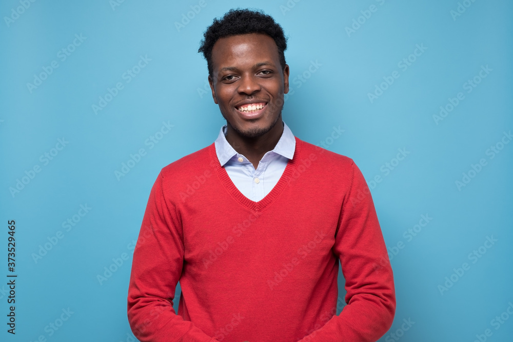 Portrait of a african smiling young man. - obrazy, fototapety, plakaty 