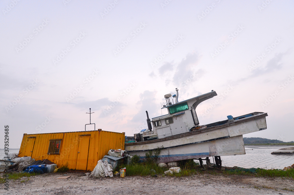 Scrapped Fishing boats at Haje Port closed by the Saemangeum seawall in Okseo-myeon, Gunsan, North Jeolla Province, South Korea on the evening of August 24, 2020.