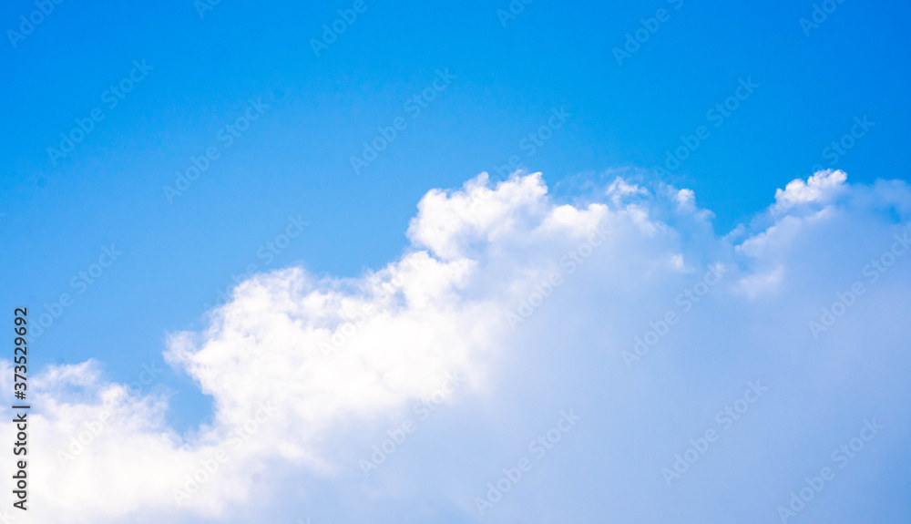 huge clouds float on the blue sky. huge clouds float on the blue sky.
