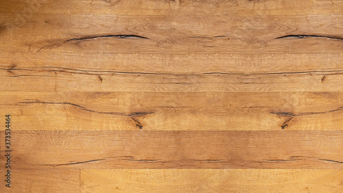wood background - top view of wooden solid wood flooring parquet laminate brushed oak country house floorboard bright