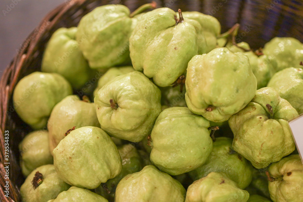 Lots of guava fruit at bazaar. agriculture farm full of organic vegetables. Pile of guavas in the store. (selective focus) Lots of guava fruit at bazaar. agriculture farm full of organic vegetables. Pile of guavas in the store. (selective focus)
