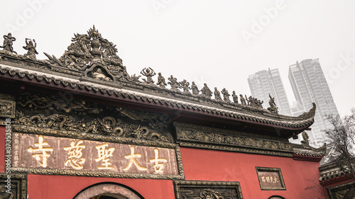 Chengdu, China. Daci Temple in Chengdu, Taikoo Li shopping centre, old and modern architecture, soft focus, front facade of a temple photo