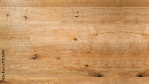 wood background - top view of wooden solid wood flooring parquet laminate brushed oak country house floorboard bright