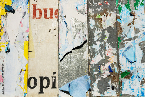 Detail of Billboard with remnants of layered, torn and peeled billboard 