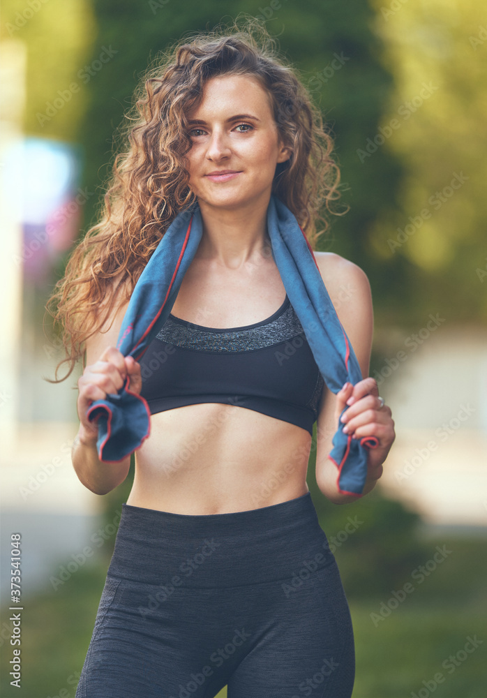 Fototapeta premium young woman resting after workout