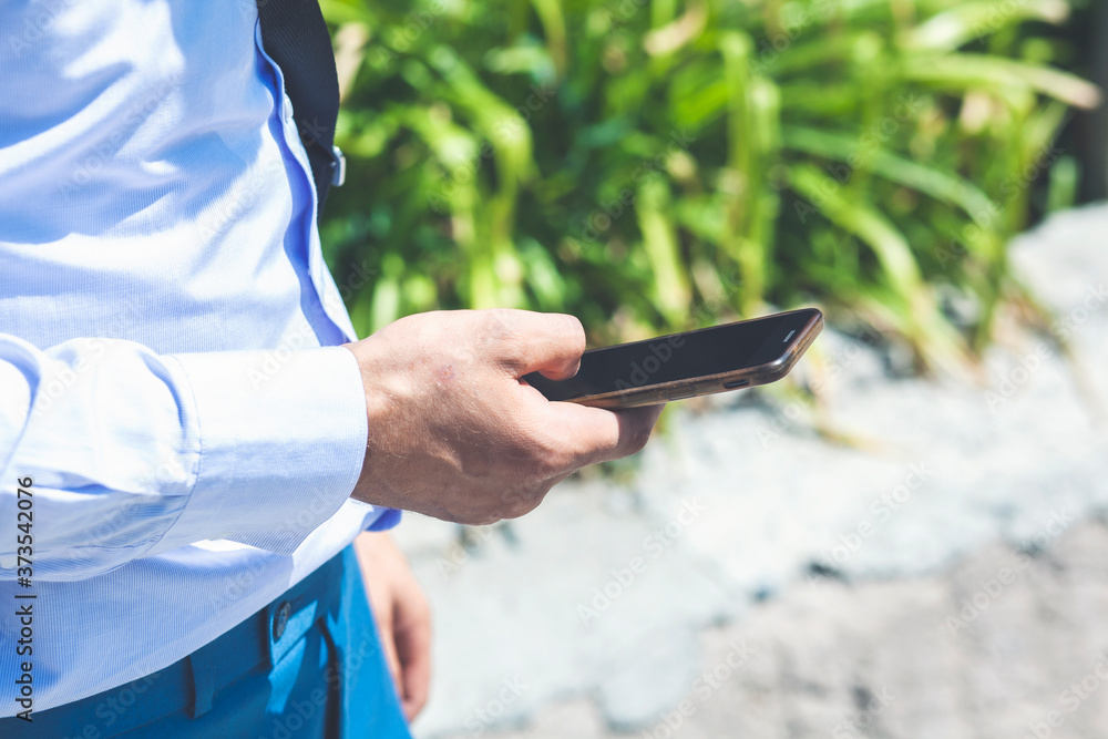 man holds the phone in his hand