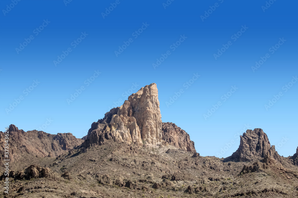 Tall towering peak in the Black Mountain range adjacent to Oatman, Arizona Tall towering peak in the Black Mountain range adjacent to Oatman, Arizona