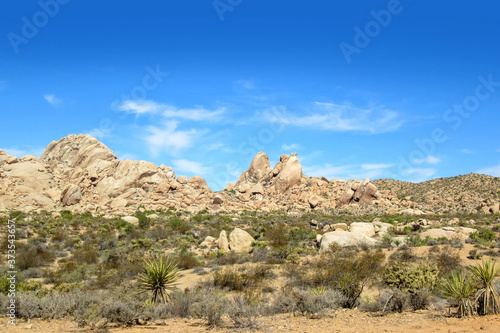 Wide angel view of a boulder mountain range in Southern Nevada