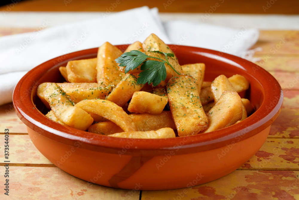 fried potatoes with salt, parsley and rosemary fried potatoes with salt, parsley and rosemary