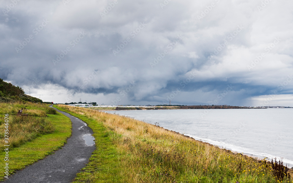 Fototapeta premium Storm clouds over Northumberland coast, UK