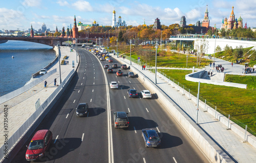 October 22, 2017 Moscow, Russia. Cars on Moskvoretskaya embankment, Zaryadye Park and a view of the Moscow Kremlin.