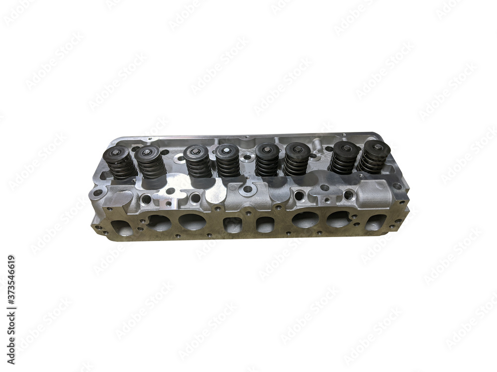 Car engine cylinder head isolated on white background. New spare parts.