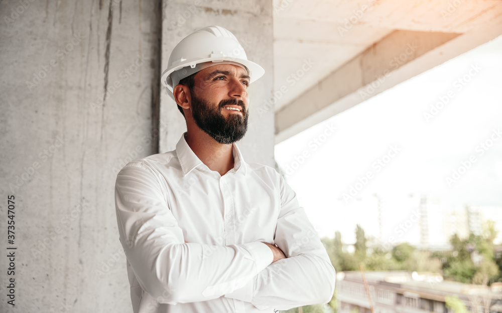 Confident architect standing on construction site Confident architect standing on construction site