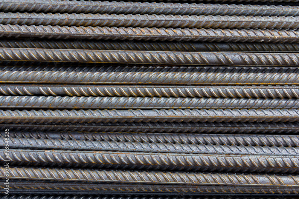 Foto de Brand new armature. Reinforcements steel bars stack. Close up ...