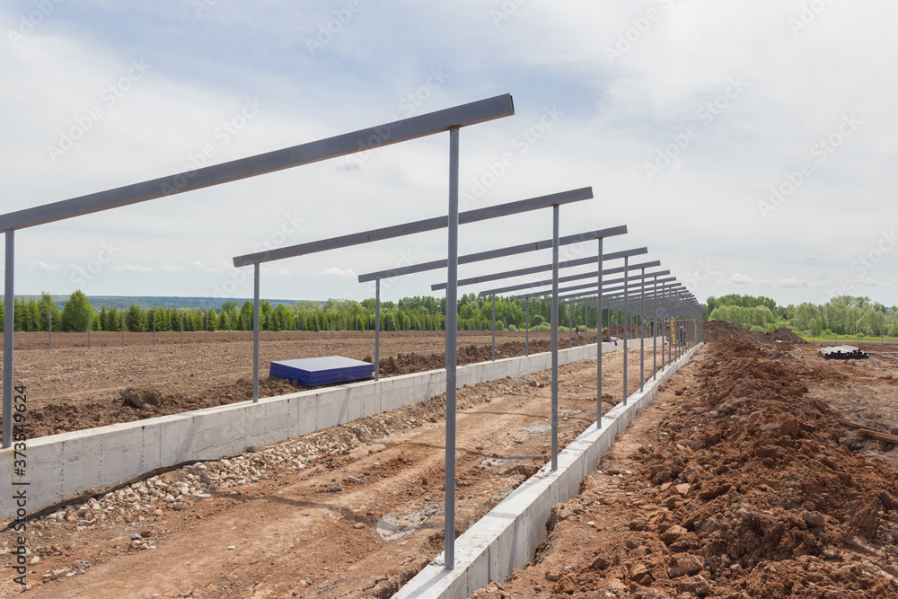 Construction steel frame of the new duilding. Construction of the main frame of the building. Agricultural buildings