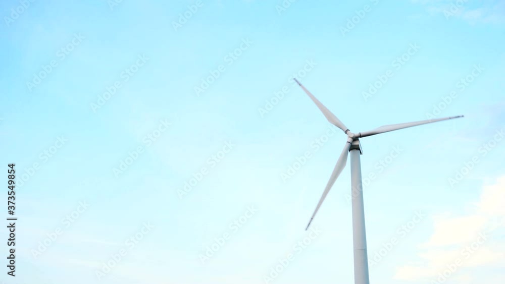 Windmill Wind power technology - low angle view on Energy Production. Background with wind turbine Windmill Wind power technology - low angle view on Energy Production. Background with wind turbine