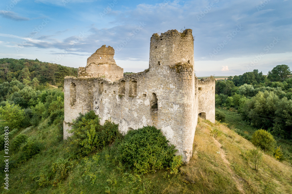 Aerial view oа Sydoriv castle ruins in a rural countryside on Sydoriv village, Ternopil region, Ukraine.