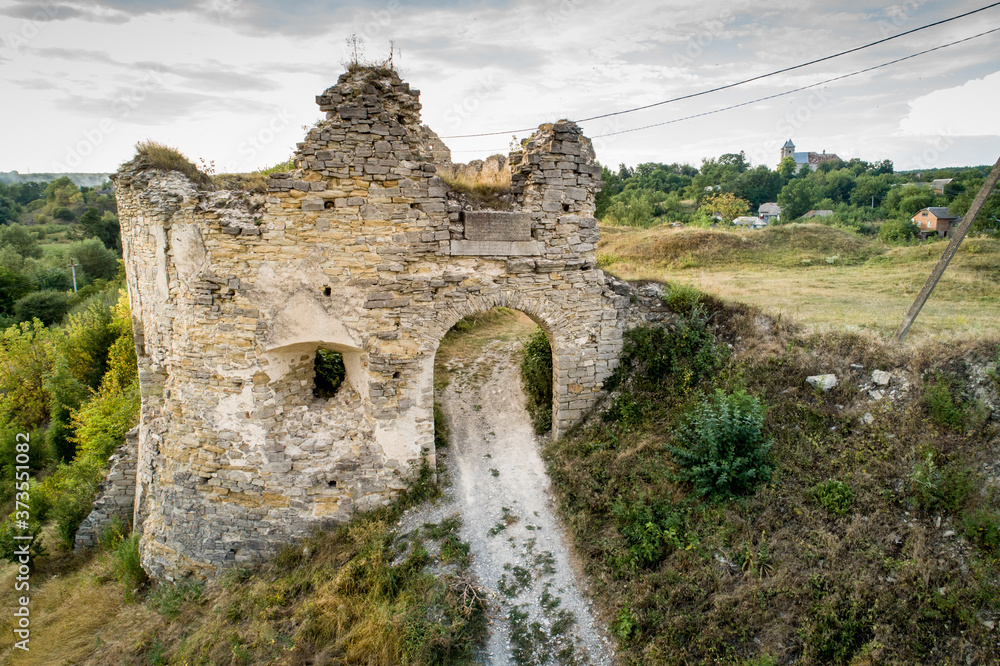 Aerial view oа Sydoriv castle ruins in a rural countryside on Sydoriv village, Ternopil region, Ukraine.