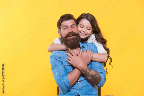 Father and happy little daughter having fun, spread love concept