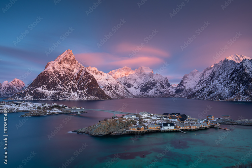 Magnificent, colorful sunrise over Sakrisoya Island. Lofoten Islands, Norway.