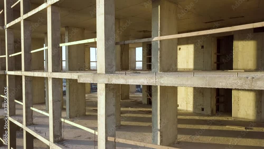 Concrete interior frame of tall apartment building under construction in a city.
Concrete interior frame of tall apartment building under construction in a city.