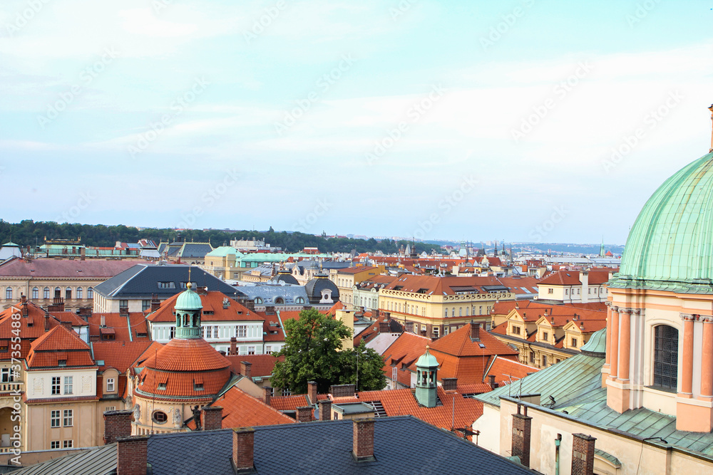 European city summer landscape, evening view of red tiled roofs