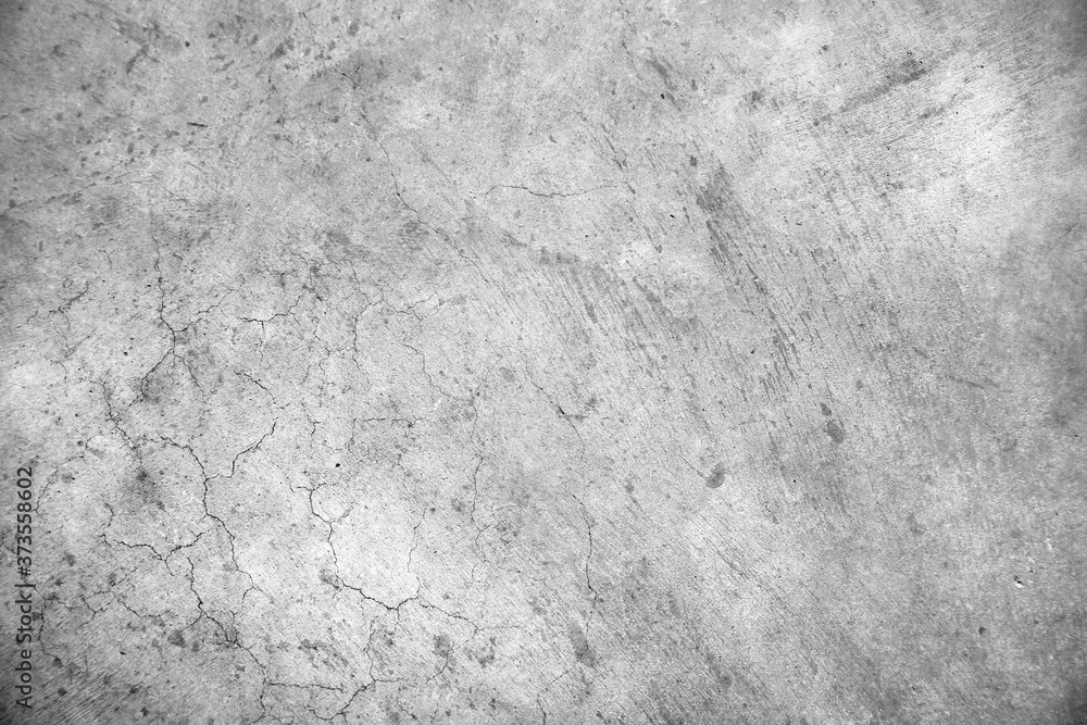 Fototapeta premium Grey rough textured cracked concrete cement stone wall texture background