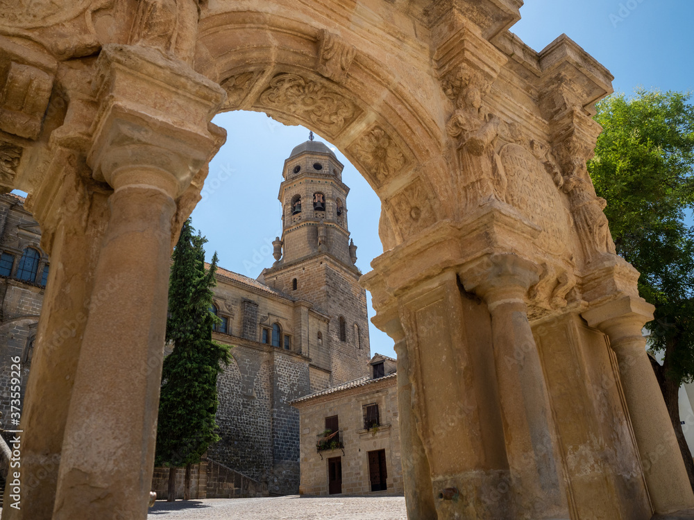 View of Baeza Cathedral in Jaen, Spain, from a point of view inside a fountain arch
