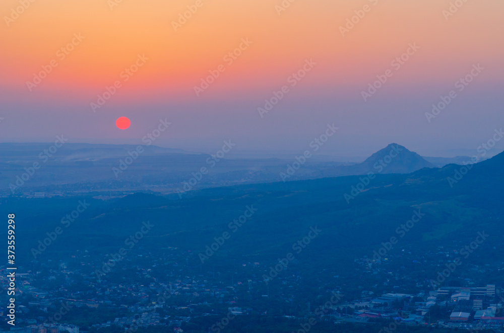 View of the city of Pyatigorsk from the top of Mashuk mountain at sunset. Stavropol Territory of the Russian Federation