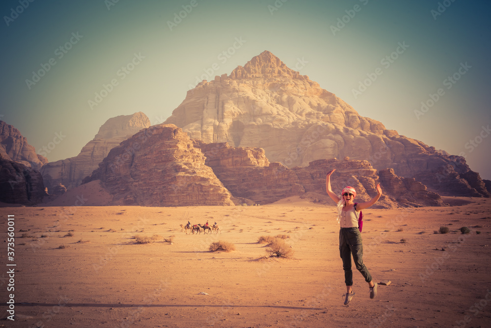 woman jumping on the desert