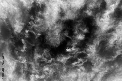 Black and white sky background texture of soft clouds.