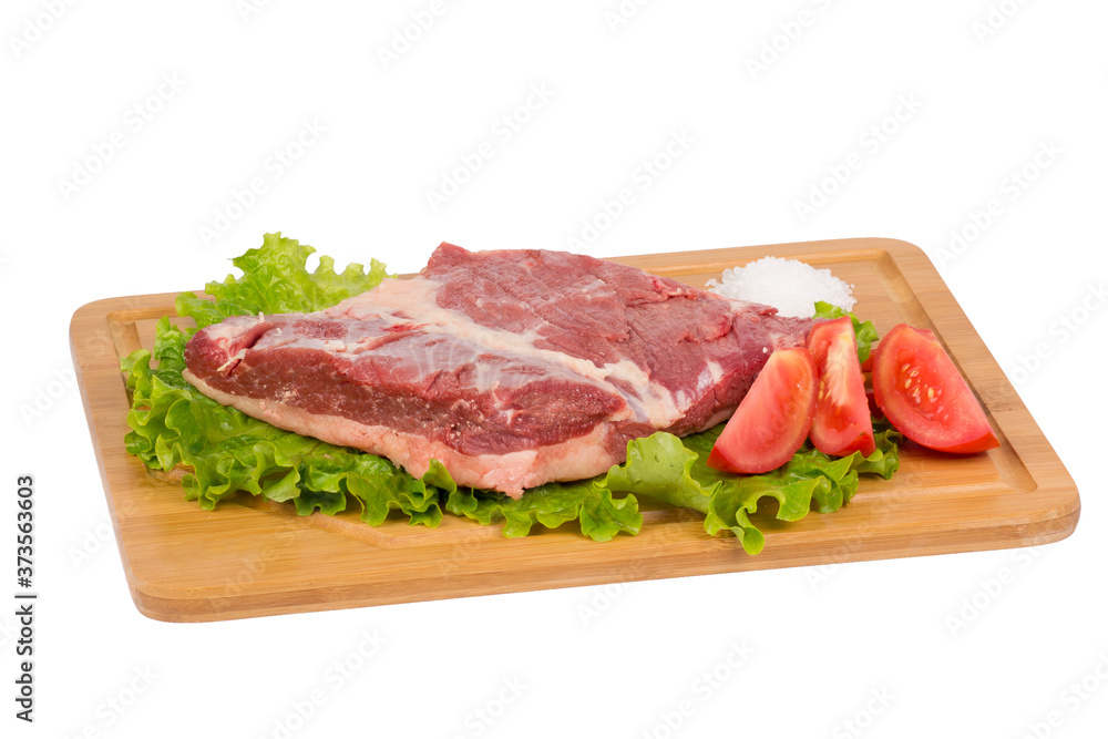 fresh and raw beef on cutting board on white background
