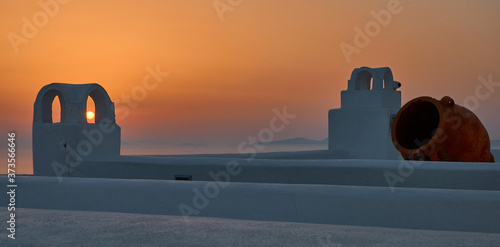 Sunlight during Santorini sunset across the fireplaces