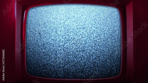 Bright and trendy red colored retro TV. 70s, 80s old style television. White noise effect on the screen. Analog Static Noise texture. Black and white offset flicker. Screen damage animated background