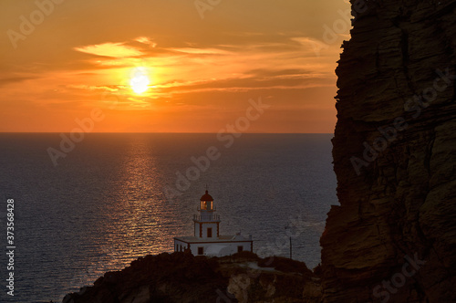 Sunset at Akrotiri lighthouse in Santorini photo
