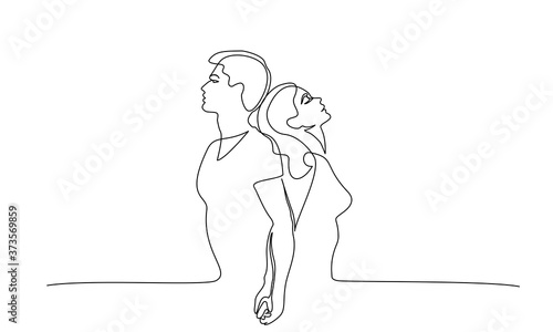 Loving couple woman and man standing back to back