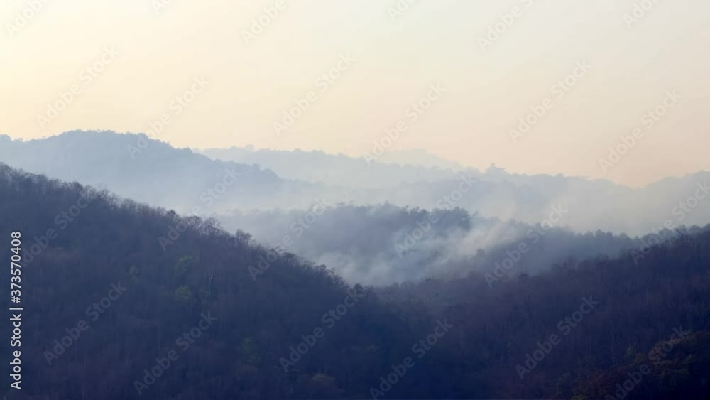 Timelapse wildfires in mountain. Aerial firefighting with wildfire during drought. Helicopter put out forestfire. Deforestation and Climate crisis. Timelapse wildfires in mountain. Aerial firefighting with wildfire during drought. Helicopter put out forestfire. Deforestation and Climate crisis.