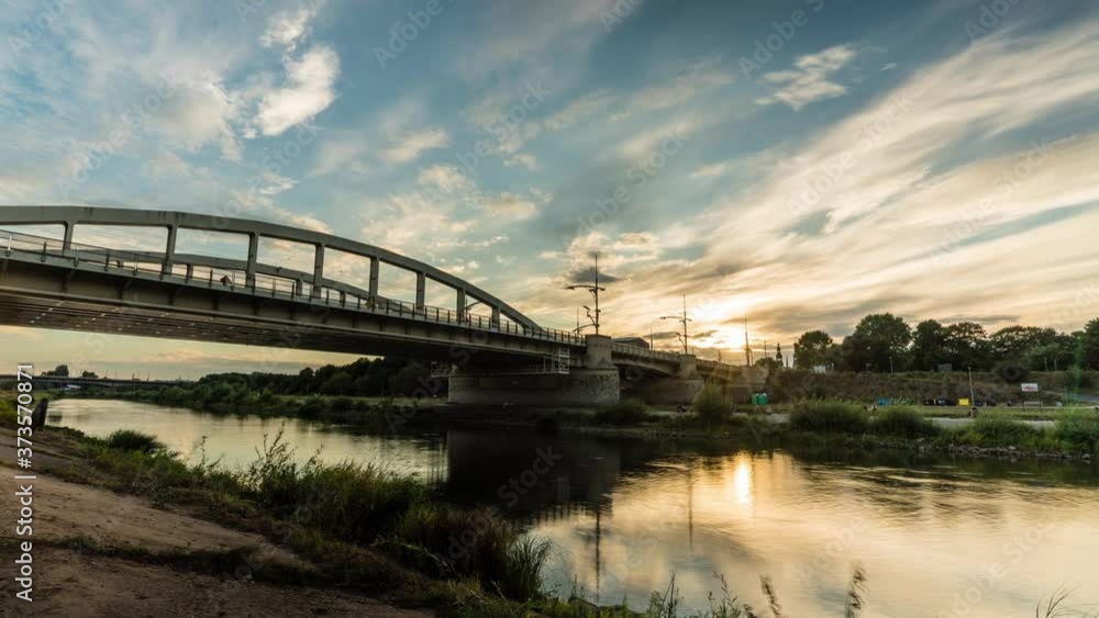 Cityscape during sunset at Warta river in Poznań, close to the St. Roch Bridge Cityscape during sunset at Warta river in Poznań, close to the St. Roch Bridge