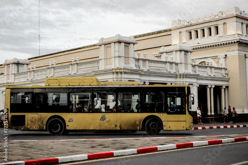 A Yellow public bus at Hua Lamphong Railway Station in Bangkok Thailand 