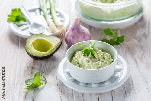 Avocado spread with curd cheese and ingredients