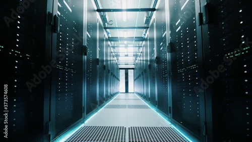 Network and data servers behind glass panels in a server room of a data center or ISP. Forward Dolly Shot