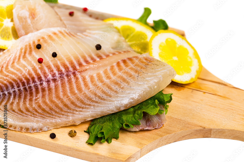Whitefish Tilapia Fish Raw Fillet Isolated on White Background. Selective focus. Whitefish Tilapia Fish Raw Fillet Isolated on White Background. Selective focus.